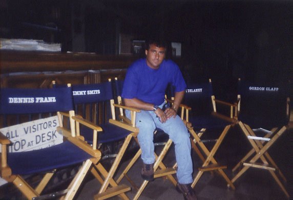 Stu Moss sitting in his chair on the set of NYPD Blue